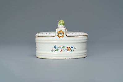 A polychrome Brussels faience '&agrave; la haie fleurie' butter tub and cover, 18th C.